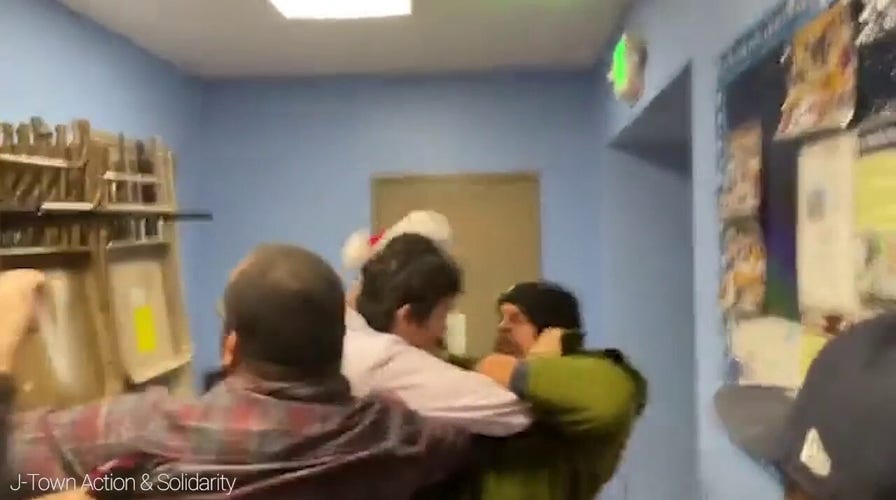 Los Angeles councilman appears to defend himself as he is mobbed by activists