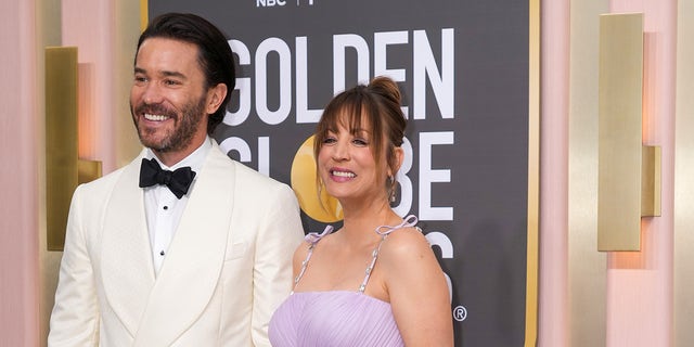 Kaley Cuoco smiling with Tom Pelphrey