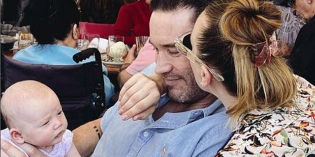Kaley Cuoco and Tom Pelphrey with their baby