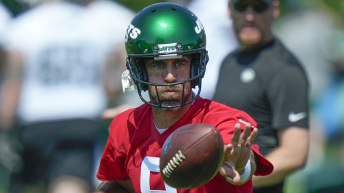 New York Jets quarterback Aaron Rodgers participates in a drill at the NFL football team's training facility in Florham Park, N.J., Sunday, July 23, 2023. (AP Photo/Seth Wenig)