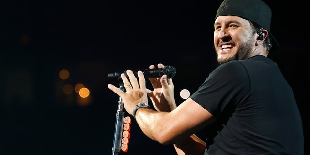 Luke Bryan on stage singing