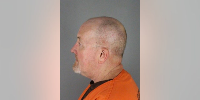 Robert DeLong mugshot side profile