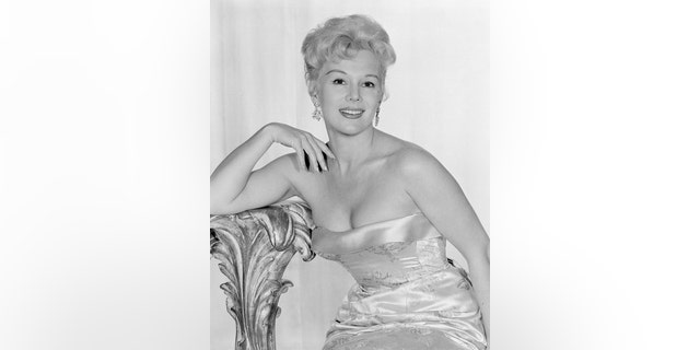 Eva Gabor in a strapless satin dress