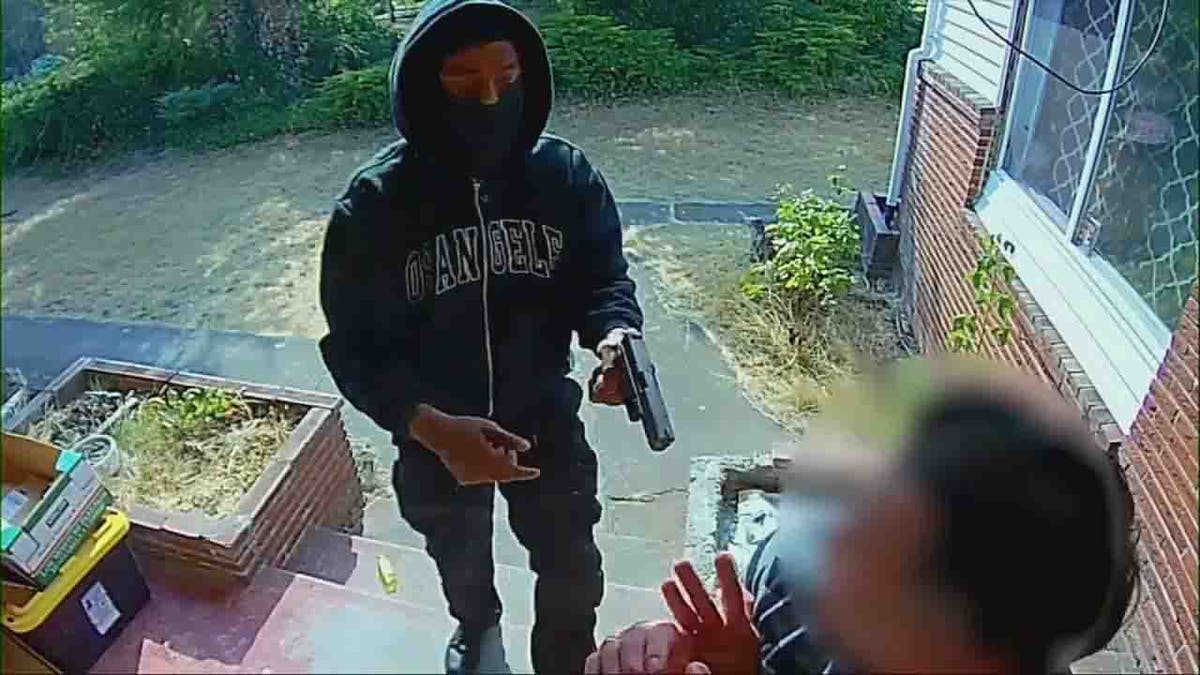 masked suspects holding victim at gunpoint