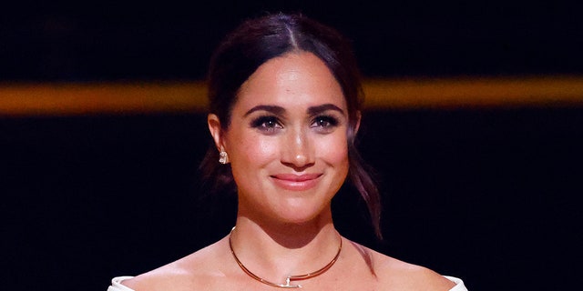 Meghan Markle smiling at an event