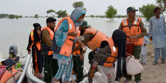 rescue team evacuates residents