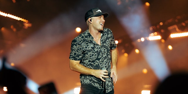 Morgan Wallen wears baseball hat over shaved head