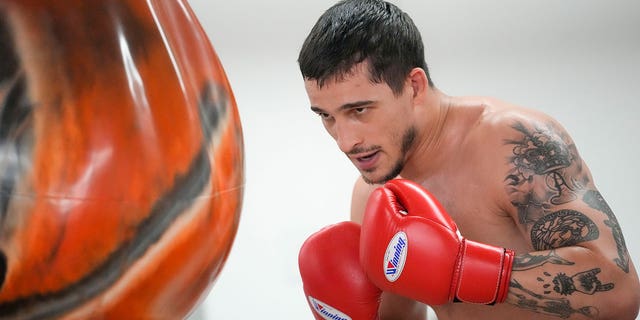 Biaggio Ali Walsh punches bag