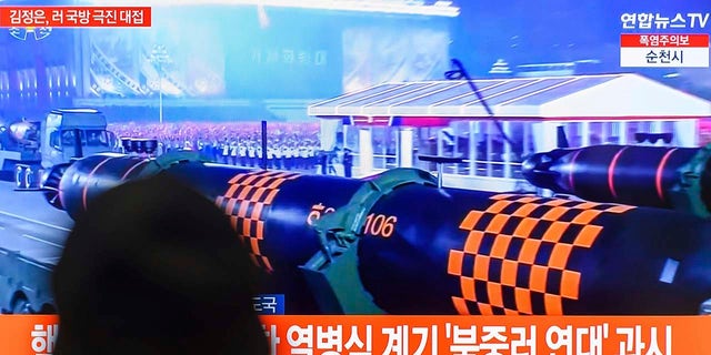 South Koreans watch North Korean military parade on TV
