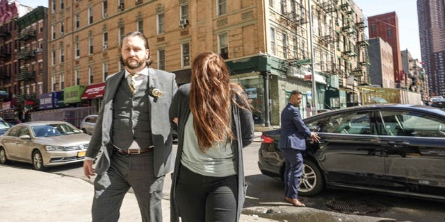 Lauren Pazienza is led into a New York City courthouse