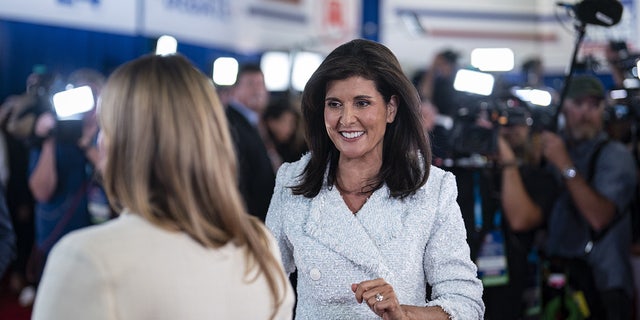 Nikki Haley walks into the spin room
