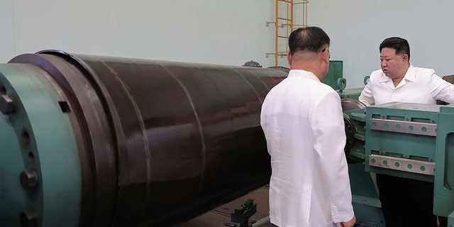 Kim looking at equipment