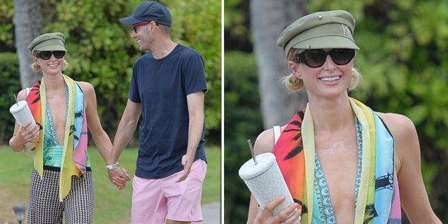Paris Hilton and Carter Reum hold hands on a walk in Maui
