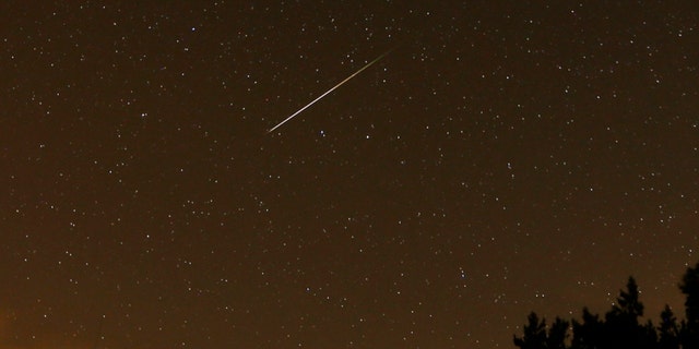 A streak appears in the sky during the annual Perseid meteor shower