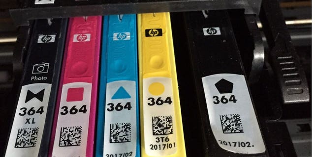 Printer ink cartridges in a printer.