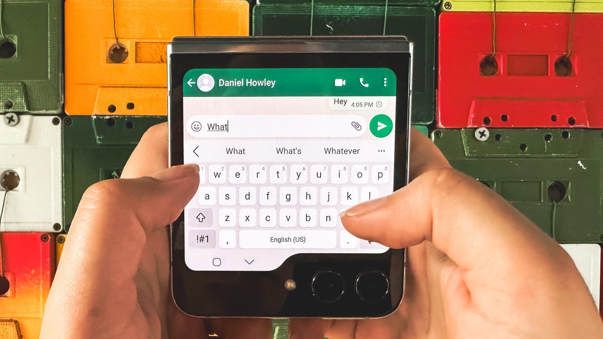 The Galaxy Z Flip 5 closed with WhatsApp open on the cover screen