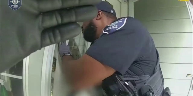 police at front door of home