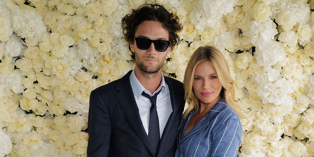 Sienna Miller and Oli Green smiling
