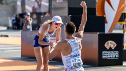 Dominik Cerny of Slovakia proposes to Hana Burzalova of Slovakia after competing in men's and women's 35 km race walk during day 6 of the 2023 World Athletics Championships on August 24, 2023 in Budapest.