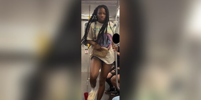 Pictured is a still from footage capturing a teen's assault on an Asian family on August 3