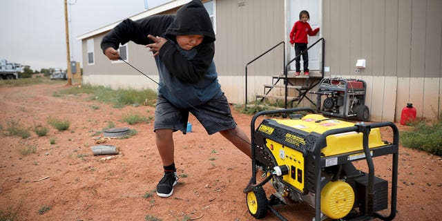 boy starts generator