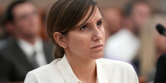 Kouri Richins, Utah mom, in white blouse in court