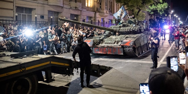 Members of Wagner group prepare to pull out from the headquarters of the Southern Military District