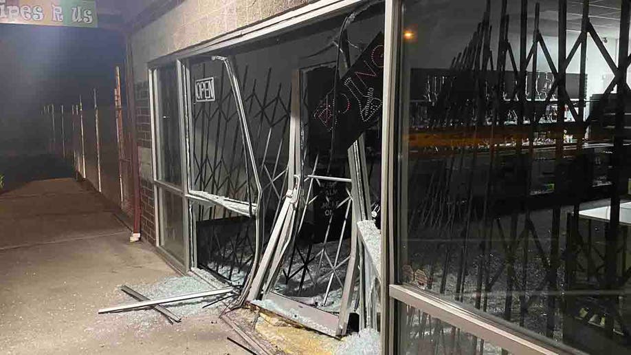 smashed store front and broken glass