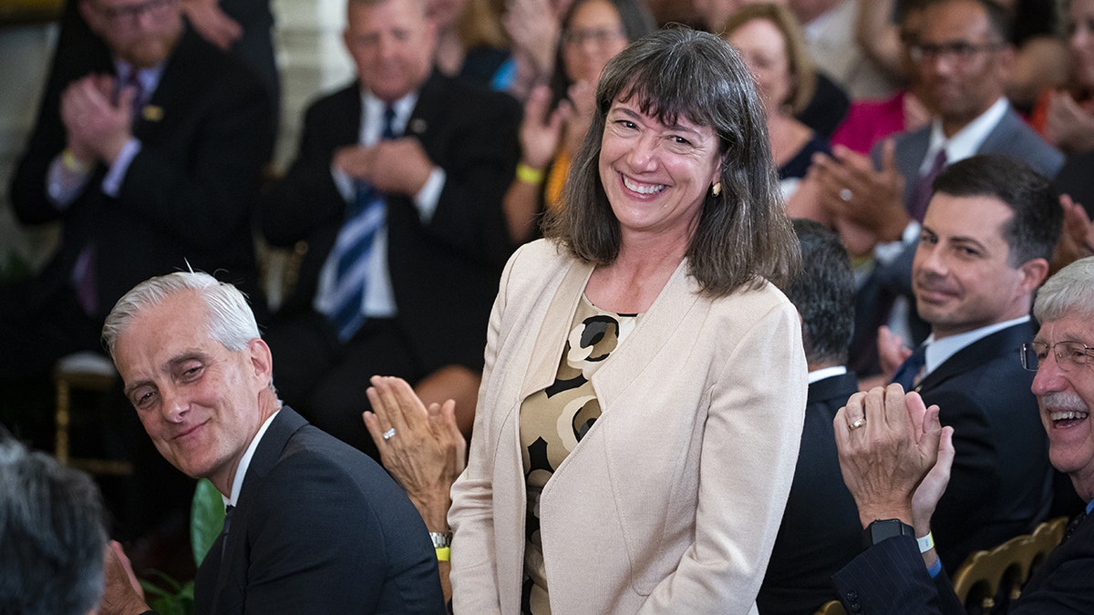 Monica Bertagnolli is recognized by President Biden (not pictured) before a cheering crowd