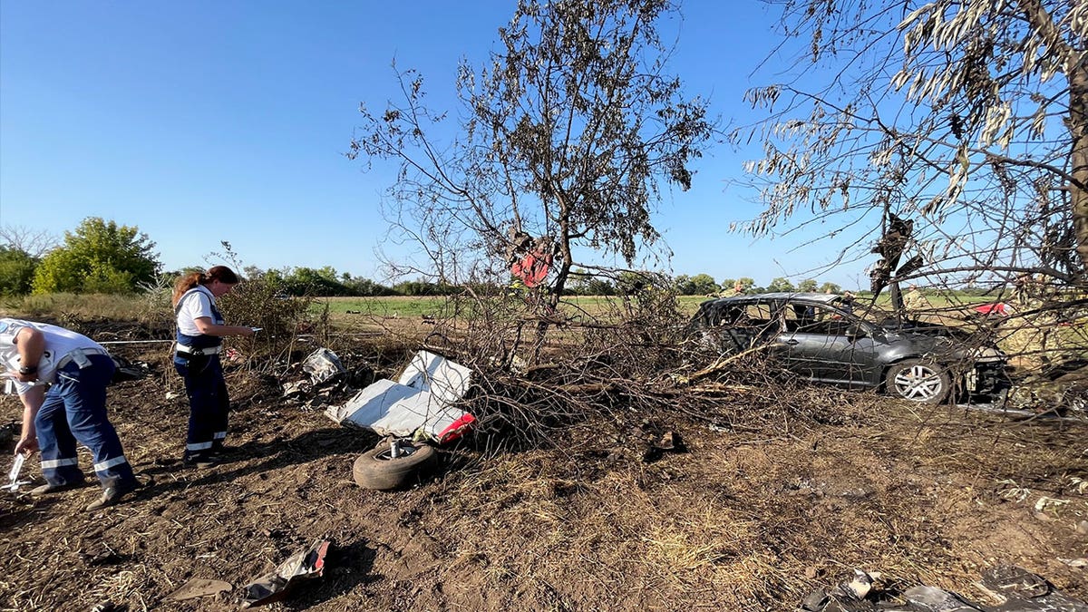 police examine crash site