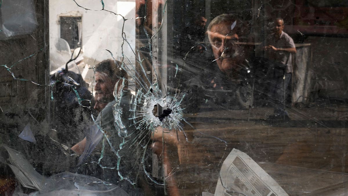 bullet hole through window