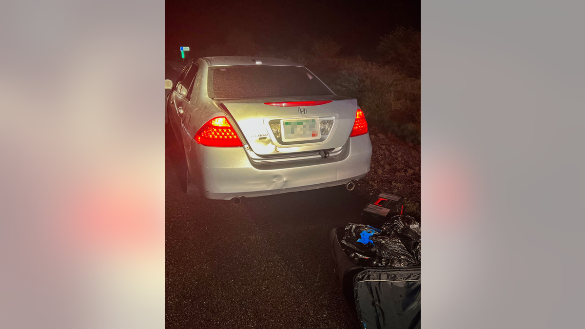 Drugs in suitcases next to car