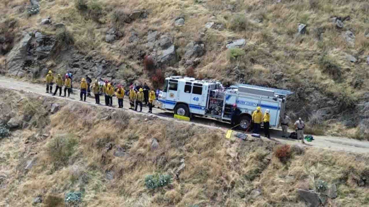 fire personnel along dirt road