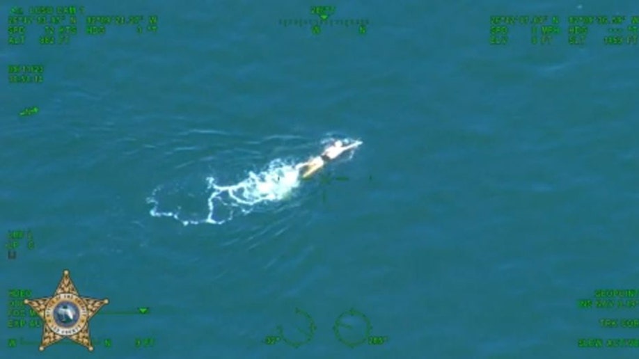 Florida mom swimming off the coast from Bokeelia Fishing Pier