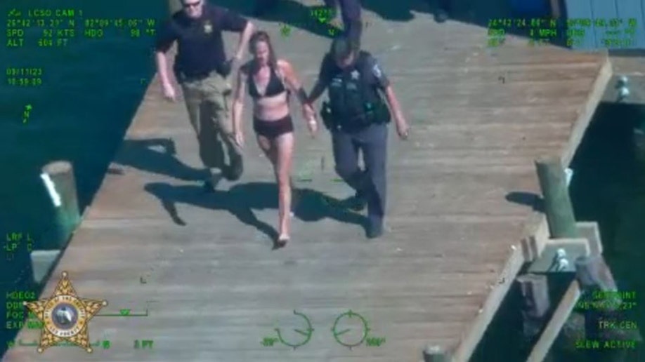 Florida mom in police custody after swimming while toddler in car