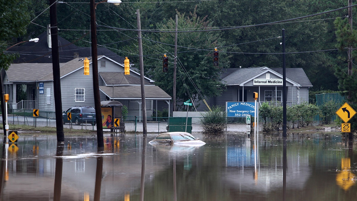 Houses surrounded and car under water in 2009 Atlanta flood