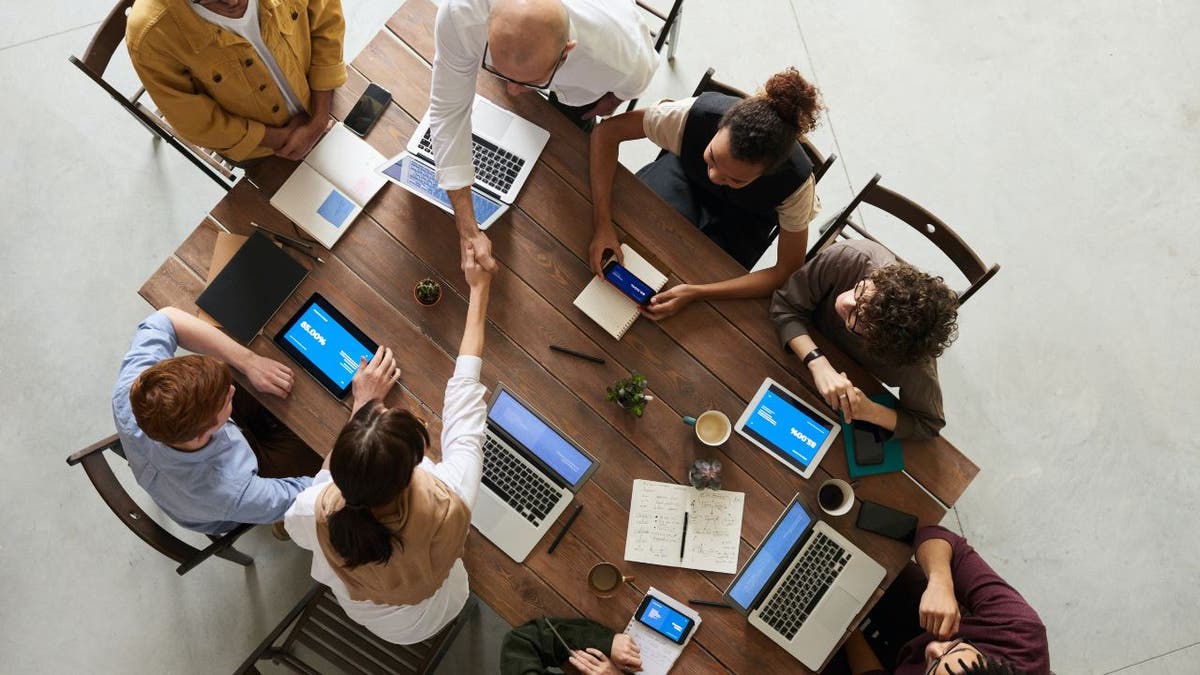 Team on laptops