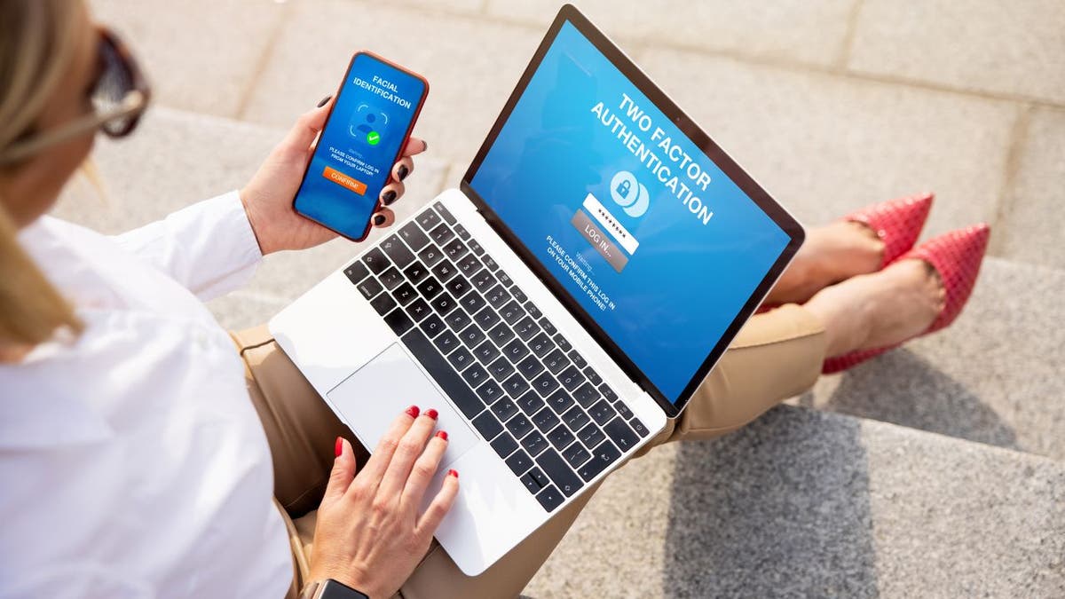 Woman signing into apps on her phone and laptop.