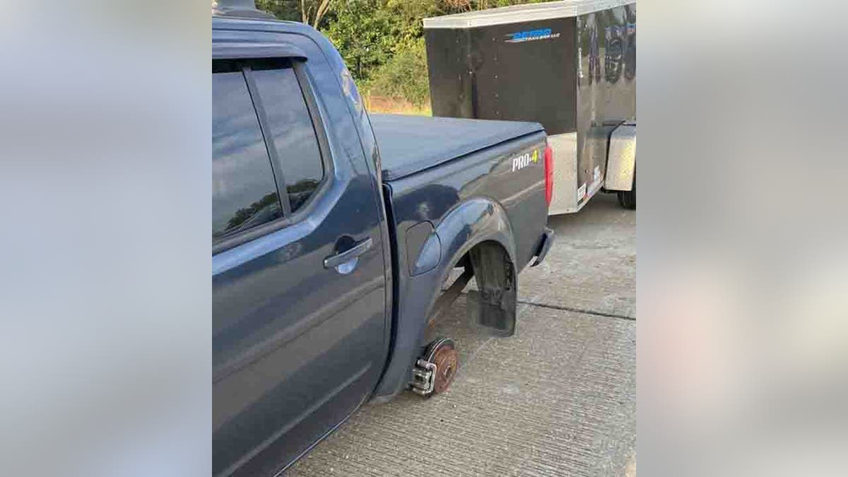 pickup truck missing wheel
