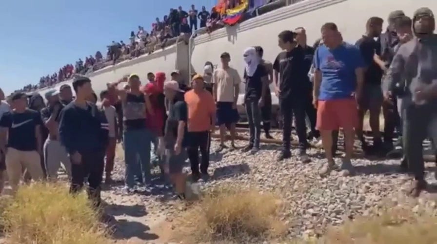 Train carrying migrants stops in Monclova, Mexico