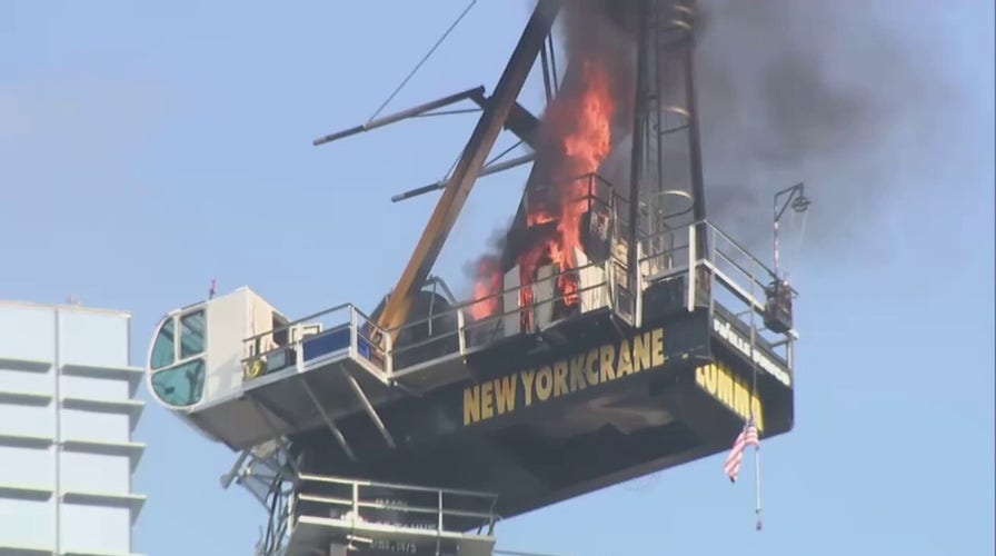 New York City construction crane catches on fire before collapse