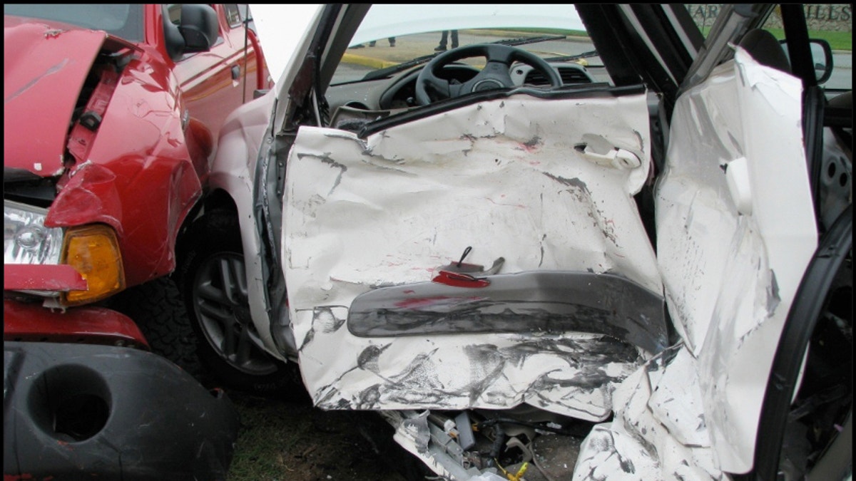 Door of car smashed in