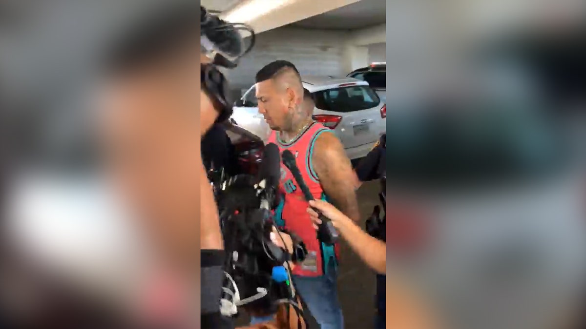 Xhavier Martinez and Felipe Valdez being perp walked outside the San Antonio Police Department