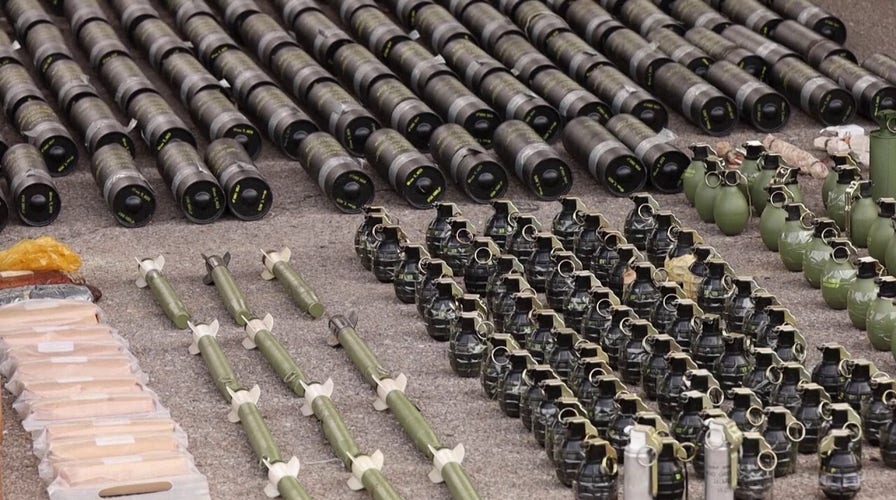 Kosovo show weapons seized after recent siege