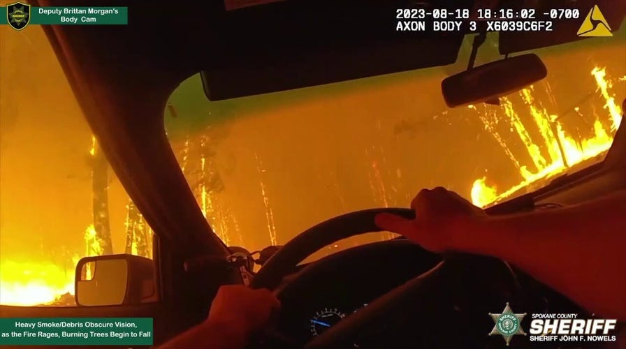 Video shows inferno surrounding Washington deputy assisting fire evacuations