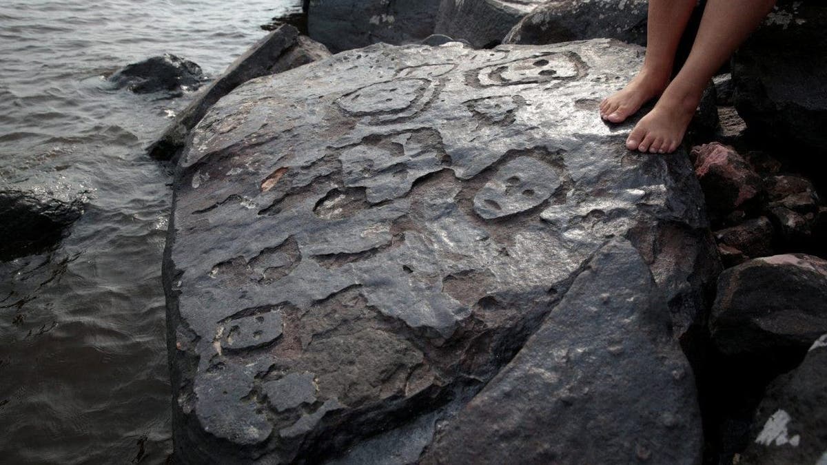 human face carvings Brazil amazon