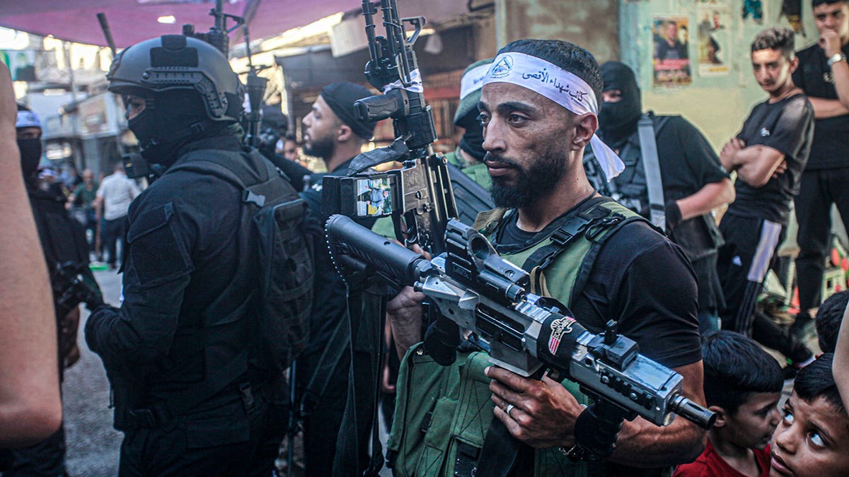 militant carrying weapon