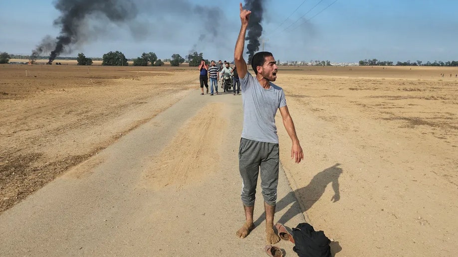 Palestinians walking away from kibbutz in Israel