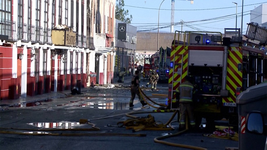 Fire crews cleanup Murcia ,Spain