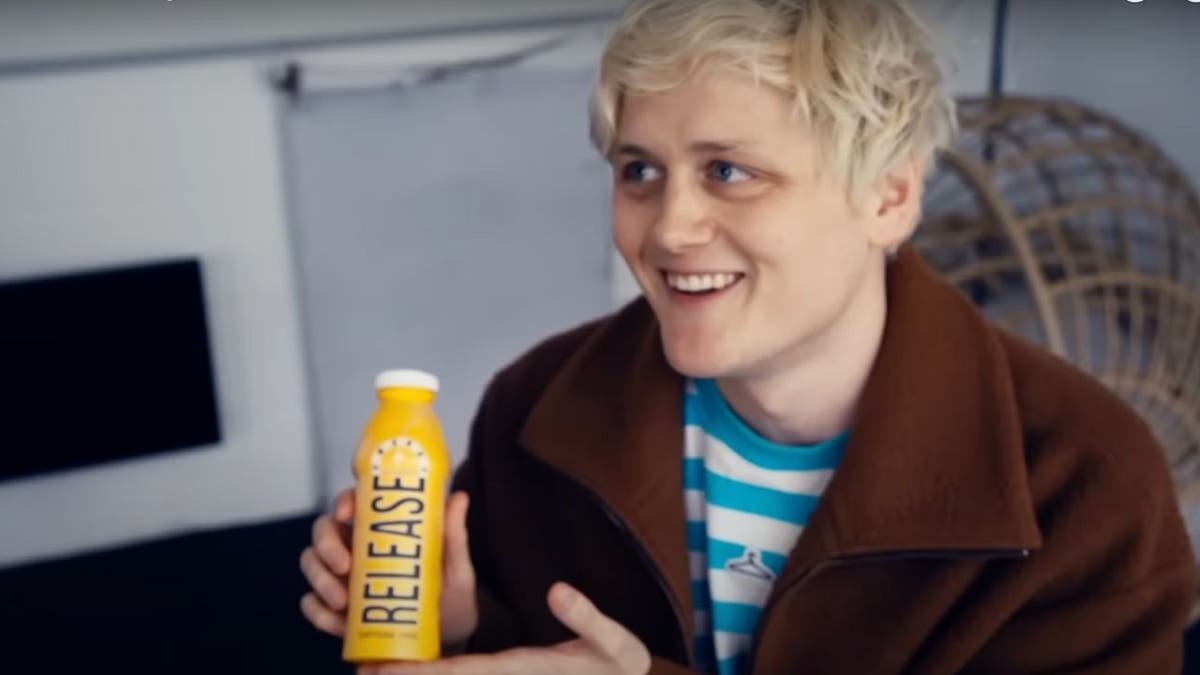 Photo of a person holding the drink.